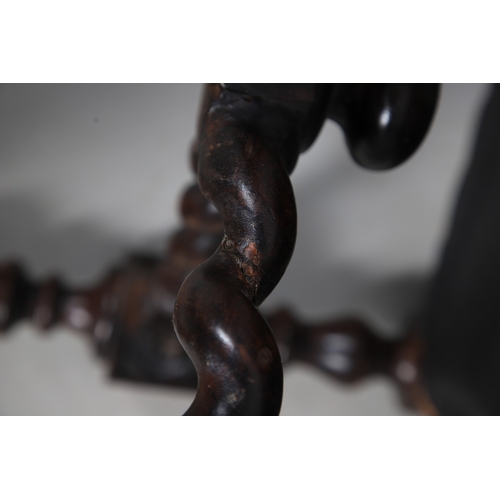 506 - A RENAISSANCE REVIVAL OAK AND WALNUT LEATHER SEATED STOOL. 19th century, the brass studded tan leath... 