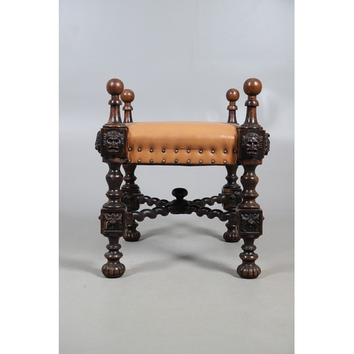 506 - A RENAISSANCE REVIVAL OAK AND WALNUT LEATHER SEATED STOOL. 19th century, the brass studded tan leath... 