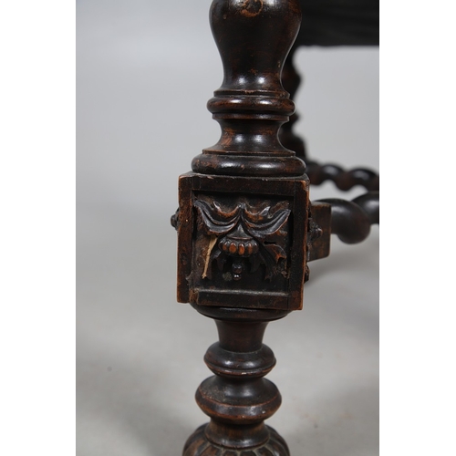 506 - A RENAISSANCE REVIVAL OAK AND WALNUT LEATHER SEATED STOOL. 19th century, the brass studded tan leath... 