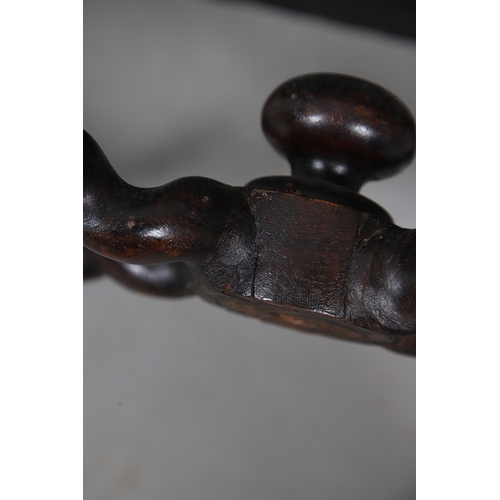 506 - A RENAISSANCE REVIVAL OAK AND WALNUT LEATHER SEATED STOOL. 19th century, the brass studded tan leath... 