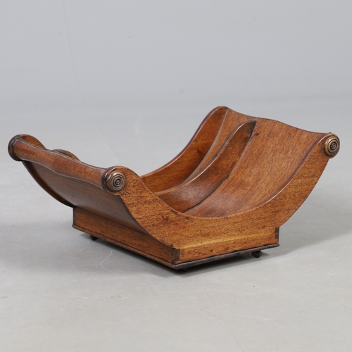 510 - A GEORGE III MAHOGANY CHEESE COASTER. the two divisions with scroll ends and swirl detail, raised on... 