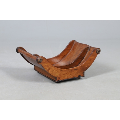 510 - A GEORGE III MAHOGANY CHEESE COASTER. the two divisions with scroll ends and swirl detail, raised on... 