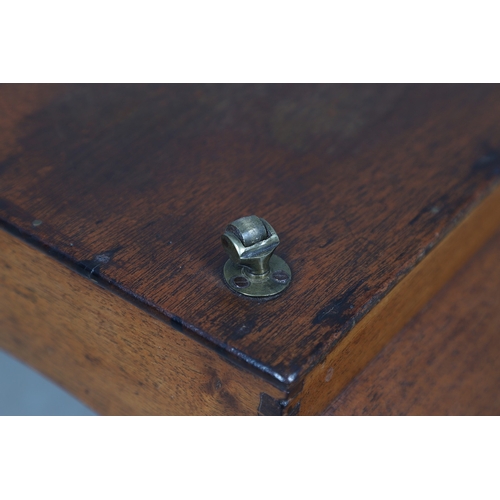 510 - A GEORGE III MAHOGANY CHEESE COASTER. the two divisions with scroll ends and swirl detail, raised on... 