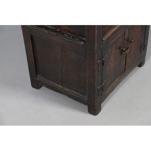 514 - AN UNUSUAL 17TH CENTURY OAK CHAIR. with panelled back and sides, hinged side flap with supporting ir... 