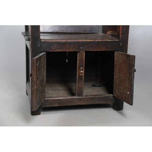 514 - AN UNUSUAL 17TH CENTURY OAK CHAIR. with panelled back and sides, hinged side flap with supporting ir... 