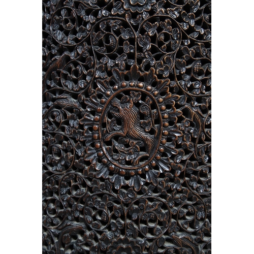 521 - A 19TH CENTURY BURMESE HARDWOOD SIDE CABINET. the raised back over a serpentine front and concave si... 