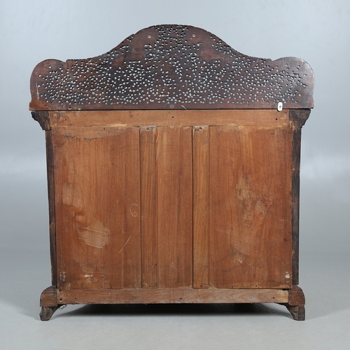 521 - A 19TH CENTURY BURMESE HARDWOOD SIDE CABINET. the raised back over a serpentine front and concave si... 