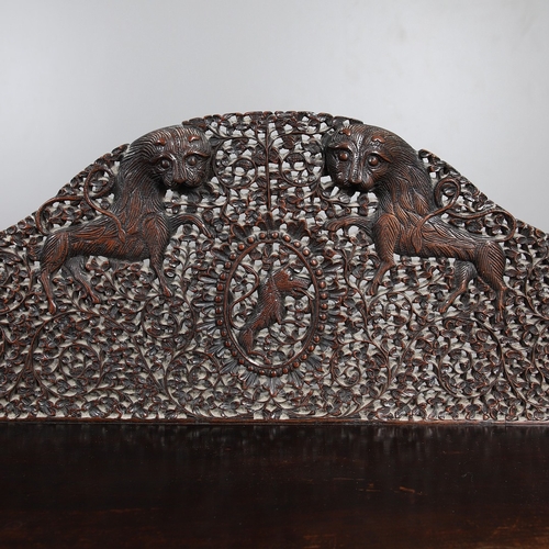 521 - A 19TH CENTURY BURMESE HARDWOOD SIDE CABINET. the raised back over a serpentine front and concave si... 