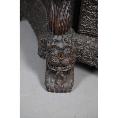 521 - A 19TH CENTURY BURMESE HARDWOOD SIDE CABINET. the raised back over a serpentine front and concave si... 