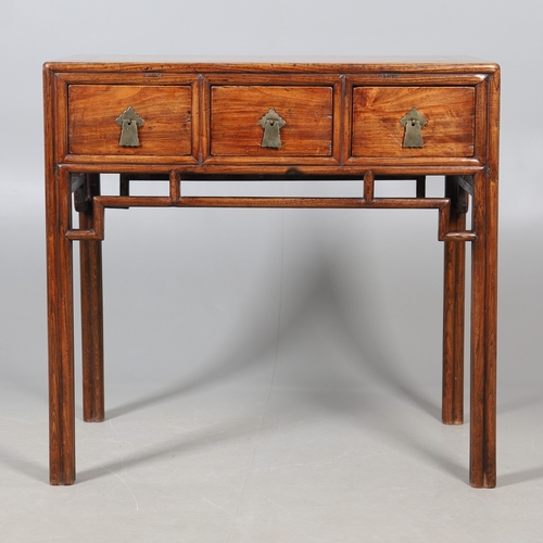 523 - A LATE 19TH/EARLY 20TH CENTURY CHINESE DONGSHAN ELM DESK. with three deep drawers to an open framewo... 
