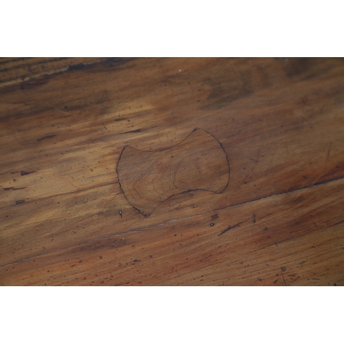 523 - A LATE 19TH/EARLY 20TH CENTURY CHINESE DONGSHAN ELM DESK. with three deep drawers to an open framewo... 