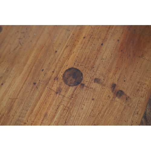 523 - A LATE 19TH/EARLY 20TH CENTURY CHINESE DONGSHAN ELM DESK. with three deep drawers to an open framewo... 