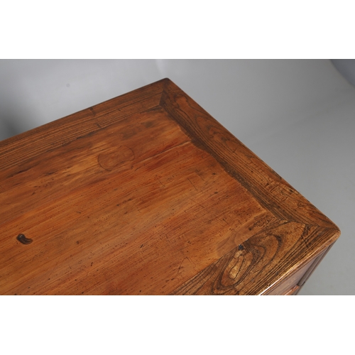 523 - A LATE 19TH/EARLY 20TH CENTURY CHINESE DONGSHAN ELM DESK. with three deep drawers to an open framewo... 