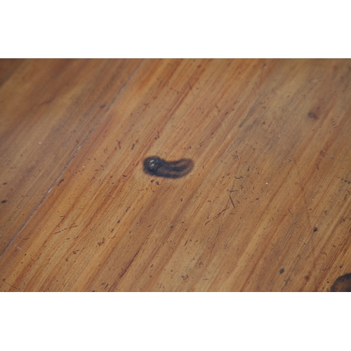 523 - A LATE 19TH/EARLY 20TH CENTURY CHINESE DONGSHAN ELM DESK. with three deep drawers to an open framewo... 