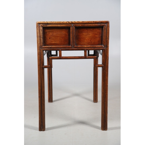 523 - A LATE 19TH/EARLY 20TH CENTURY CHINESE DONGSHAN ELM DESK. with three deep drawers to an open framewo... 