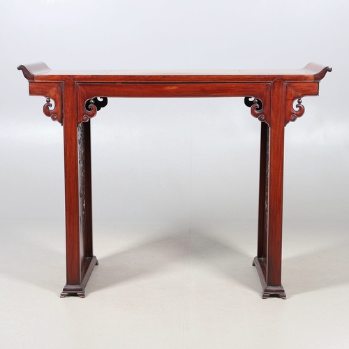 524 - A CHINESE HUANGHUALI HARDWOOD ALTER STYLE TABLE. mid-late 20th century, the scroll ended top with in... 