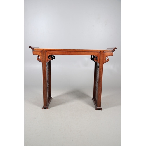 524 - A CHINESE HUANGHUALI HARDWOOD ALTER STYLE TABLE. mid-late 20th century, the scroll ended top with in... 