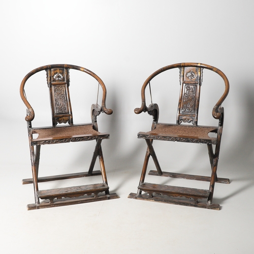 526 - A PAIR OF CHINESE MING DYNASTY STYLE HARDWOOD FOLDING CHAIRS. the horseshoe shaped back to a central... 