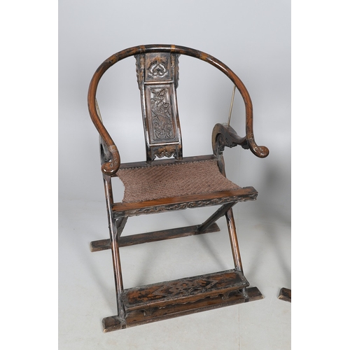 526 - A PAIR OF CHINESE MING DYNASTY STYLE HARDWOOD FOLDING CHAIRS. the horseshoe shaped back to a central... 