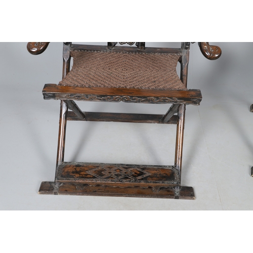 526 - A PAIR OF CHINESE MING DYNASTY STYLE HARDWOOD FOLDING CHAIRS. the horseshoe shaped back to a central... 