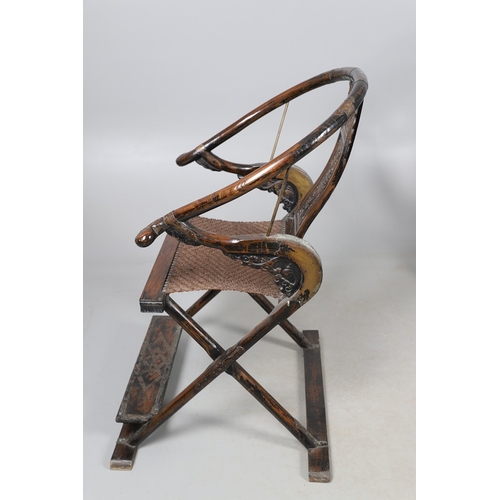 526 - A PAIR OF CHINESE MING DYNASTY STYLE HARDWOOD FOLDING CHAIRS. the horseshoe shaped back to a central... 