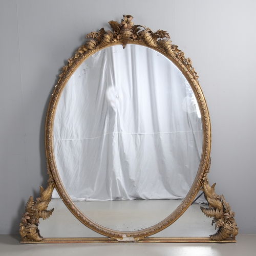 535 - A LARGE 19TH CENTURY GILT GESSO OVAL WALL MIRROR. the tripple section plate to a wire mounted gilt g... 