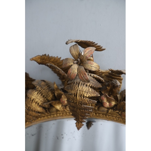 535 - A LARGE 19TH CENTURY GILT GESSO OVAL WALL MIRROR. the tripple section plate to a wire mounted gilt g... 