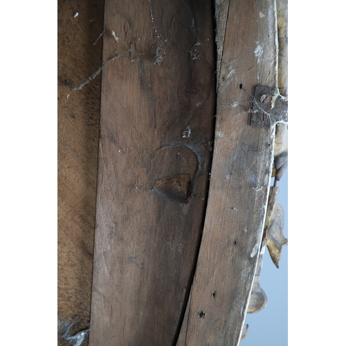 535 - A LARGE 19TH CENTURY GILT GESSO OVAL WALL MIRROR. the tripple section plate to a wire mounted gilt g... 