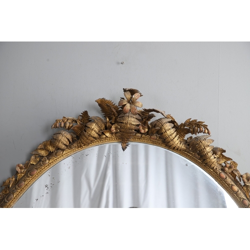 535 - A LARGE 19TH CENTURY GILT GESSO OVAL WALL MIRROR. the tripple section plate to a wire mounted gilt g... 