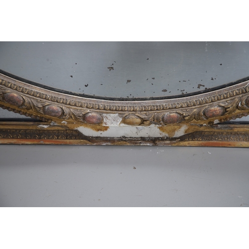 535 - A LARGE 19TH CENTURY GILT GESSO OVAL WALL MIRROR. the tripple section plate to a wire mounted gilt g... 