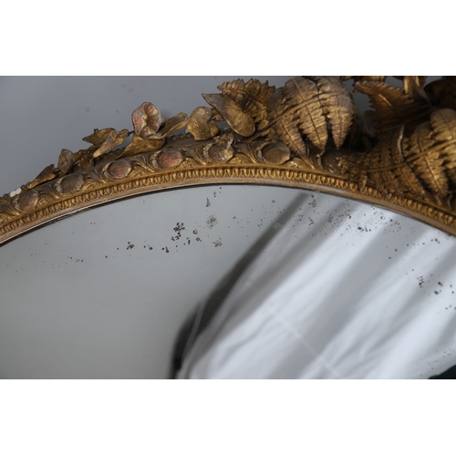 535 - A LARGE 19TH CENTURY GILT GESSO OVAL WALL MIRROR. the tripple section plate to a wire mounted gilt g... 