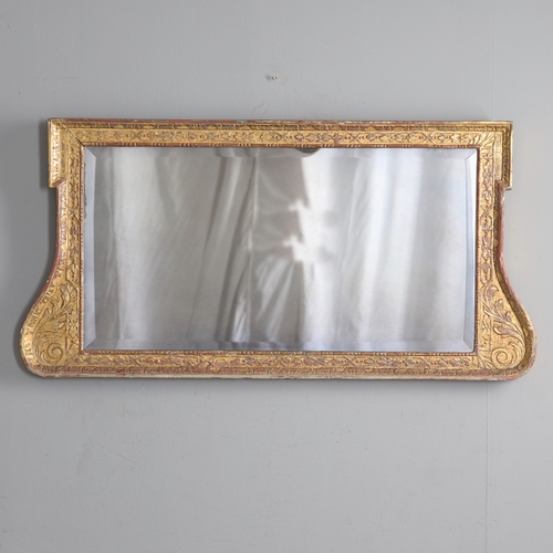 537 - A GEORGE II GILTWOOD AND GESSO OVERMANTLE MIRROR. the bevelled plate to a shallow-relief moulded fra... 