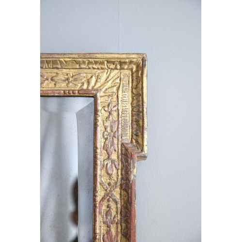 537 - A GEORGE II GILTWOOD AND GESSO OVERMANTLE MIRROR. the bevelled plate to a shallow-relief moulded fra... 