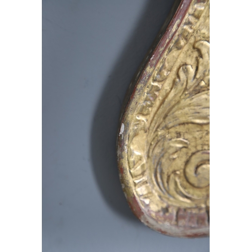 537 - A GEORGE II GILTWOOD AND GESSO OVERMANTLE MIRROR. the bevelled plate to a shallow-relief moulded fra... 