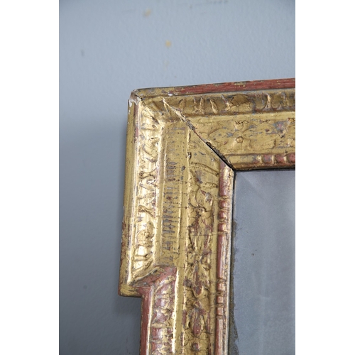 537 - A GEORGE II GILTWOOD AND GESSO OVERMANTLE MIRROR. the bevelled plate to a shallow-relief moulded fra... 