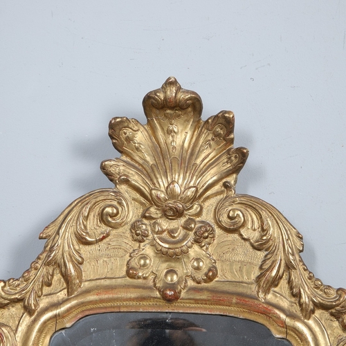 541 - AN 18TH CENTURY GILTWOOD PIER MIRROR. the split rectangular bevelled plate with flowerhead cut motif... 