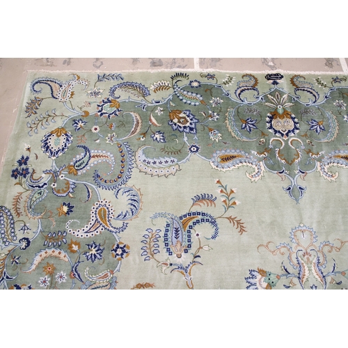 546 - A KASHAN CARPET, CIRCA 1970. The ice blue field centred by a flowerhead medallion surrounded by vine... 