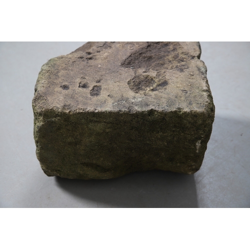 554 - A MEDIEVAL STONE CORBEL. possibly 15th century, carved with a head of a curly haired man, height 22c... 