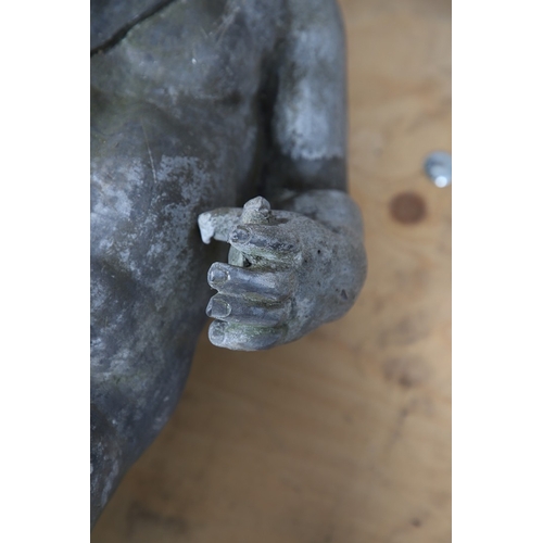 562 - A PAIR OF 19TH CENTURY LEAD GARDEN STATUES OF PUTTI. modelled wearing military style helmets, one wi... 