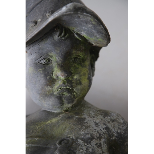 562 - A PAIR OF 19TH CENTURY LEAD GARDEN STATUES OF PUTTI. modelled wearing military style helmets, one wi... 