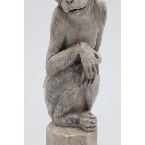 585 - SIGNED MARBLE SCULPTURE OF A RHESUS MONKEY. In the manner of Wilhelm Krieger, a carved marble figure... 