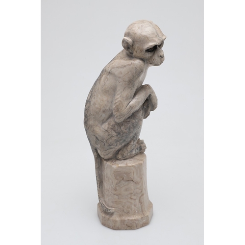 585 - SIGNED MARBLE SCULPTURE OF A RHESUS MONKEY. In the manner of Wilhelm Krieger, a carved marble figure... 
