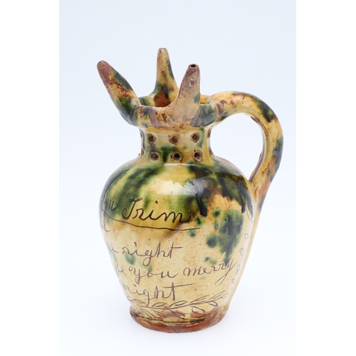 603 - DONYATT POTTERY PUZZLE JUG - 1896. A late 19thc Donyatt Pottery slipware puzzle jug, inscribed to 'W... 