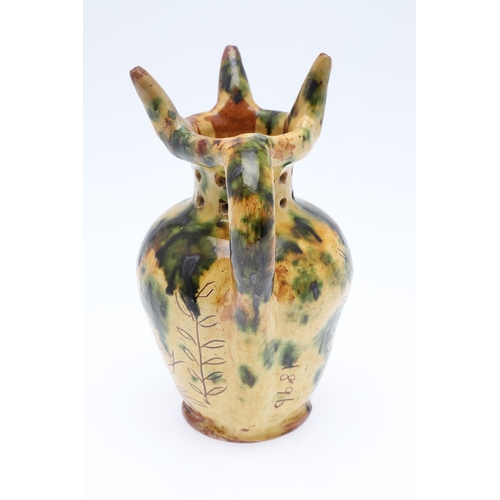 603 - DONYATT POTTERY PUZZLE JUG - 1896. A late 19thc Donyatt Pottery slipware puzzle jug, inscribed to 'W... 