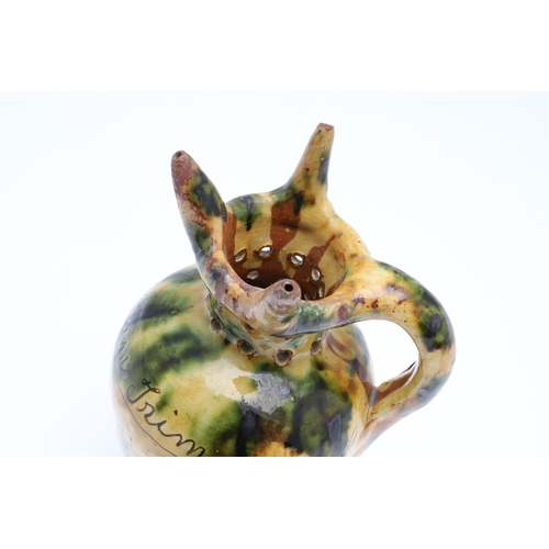 603 - DONYATT POTTERY PUZZLE JUG - 1896. A late 19thc Donyatt Pottery slipware puzzle jug, inscribed to 'W... 