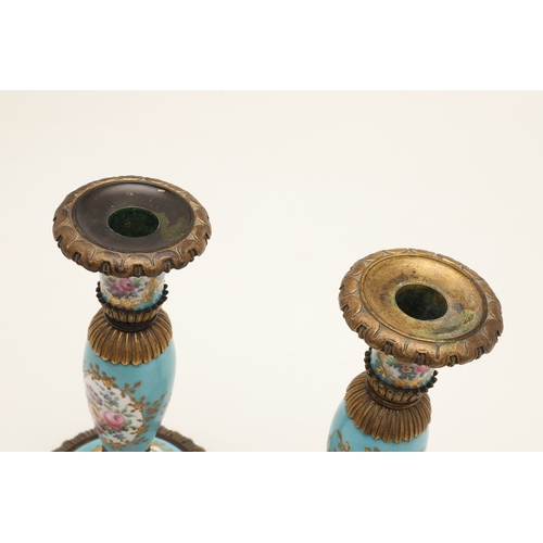 619 - PAIR OF FRENCH 19THC PORCELAIN & GILT METAL CANDLESTICKS. The porcelain sections painted with flower... 