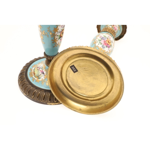 619 - PAIR OF FRENCH 19THC PORCELAIN & GILT METAL CANDLESTICKS. The porcelain sections painted with flower... 