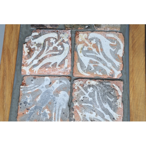622 - VARIOUS MEDIEVAL POTTERY FLOOR TILES. A variety of medieval floor tiles, some glazed and set into re... 