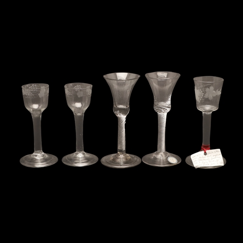 627 - 18THC WINE GLASSES. Including a pair of wine glasses, the bowls engraved with fruiting vine and with... 