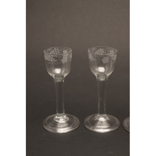 627 - 18THC WINE GLASSES. Including a pair of wine glasses, the bowls engraved with fruiting vine and with... 